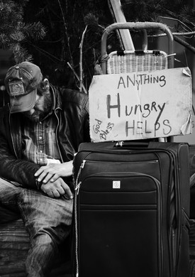 Spend $1,000 for each hungry and homeless person